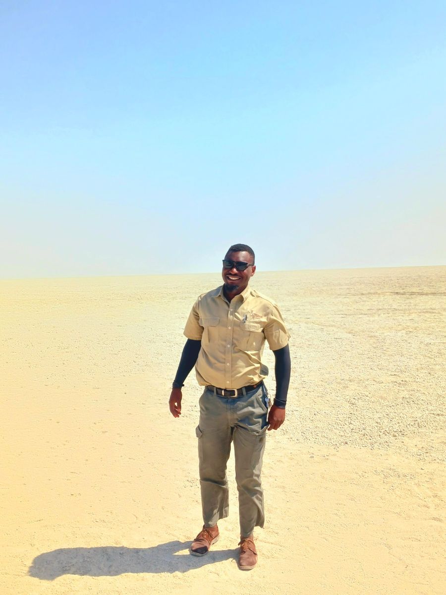 An Oosino guide standing on the Etosha salt pan